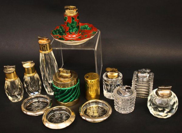 VINTAGE TIFFANY & CO, ALANTIS, ITALIAN LIGHTERS: (lot) Vintage lighters and ashtrays, makers such as vintage Tiffany & Co, Colibri, Atlantis, Italian, Fitz and Floyd porcelain; trio of ashtrays including makers of (1) Frank M. Whiting & Co silver ri