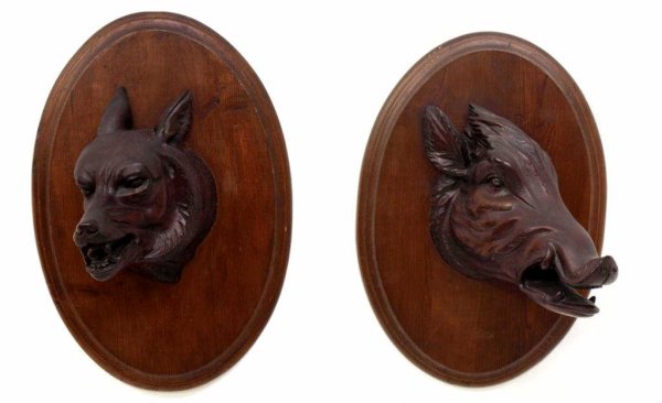 BLACK FOREST CARVED HUNT TROPHY BOAR & DOG MOUNT: (lot of 2) Black Forest carved hunt plaques; (1) the head of snarling dog, partial owners tag "Filberto Garcia San Antonio", overall 18"h, 12.5"w; (1) a trophy mount carved as a snarling boar, overall