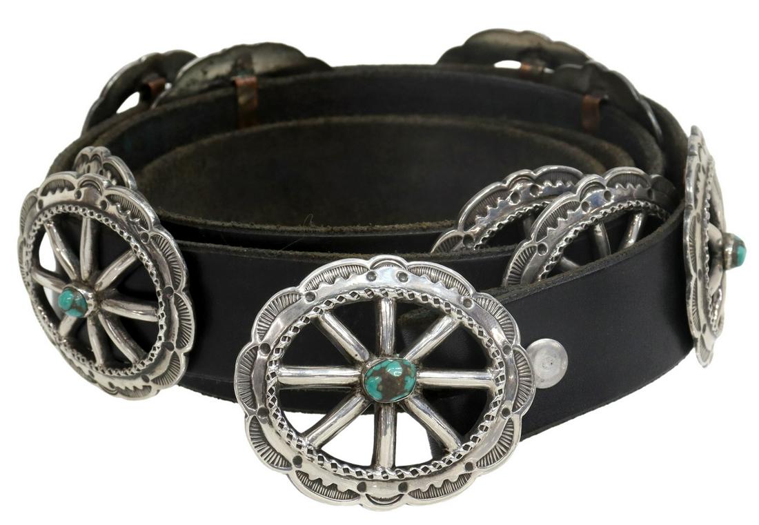 NELLIE TSO NAVAJO SILVER & TURQUOISE CONCHO BELT: Native American silver (content unknown) concho belt, signed N. Tso (Nellie Tso, Navajo/ Dine, Arizona, 1932-2011), nine conchas and belt buckle, spoked wheel design, each set with a turquoise cabocho