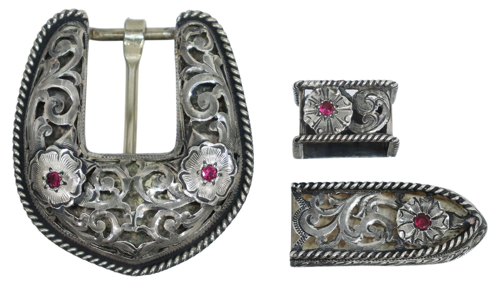 MORTENSON SOUTHWEST FANCY BELT BUCKLE SET: Southwest belt buckle set by Mortenson Silver Saddles, Santa Fe, the buckle with filigree and foliate cutout and having a 3/4" bar, the belt loop and tip marked sterling, all three pieces accented wit