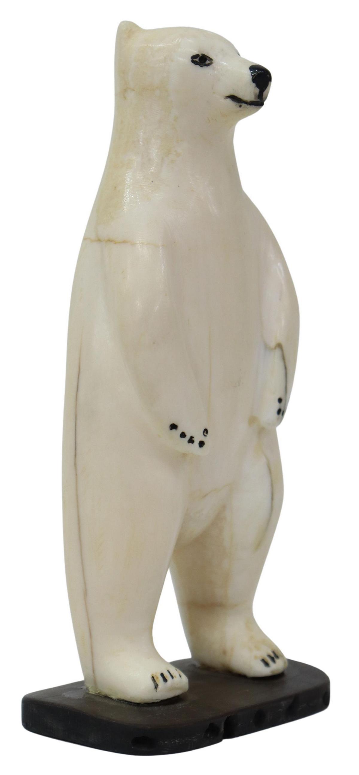 INUIT CARVED BONE STANDING POLAR BEAR: Carved Inuit walrus bone, Standing Polar Bear, signed at the underside, Harry Broc?? (sp), dated 1984, illegible city, Alaska, overall: approx. 5"h 2.5"w, 1.5"d Start Price: $150.00