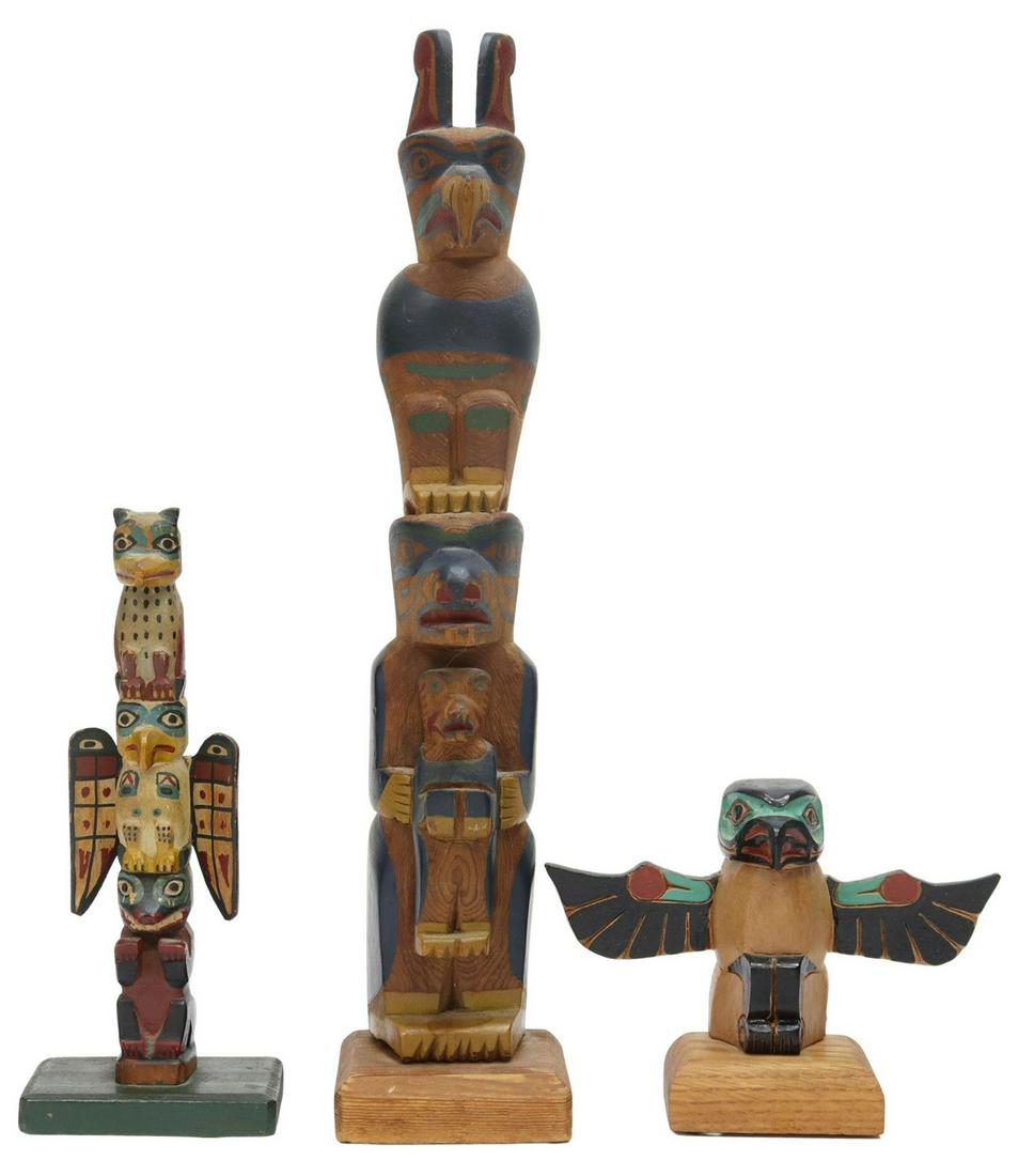 (3) NORTHWEST COAST CARVED WOOD TOTEM POLES: (lot of 3) Pacific Northwest Coast carved and polychrome painted wood totem poles, 20th c., comprising: (1) eagle, Tlingit Totems, Alaska, retaining original label, intact with glue restoration to win