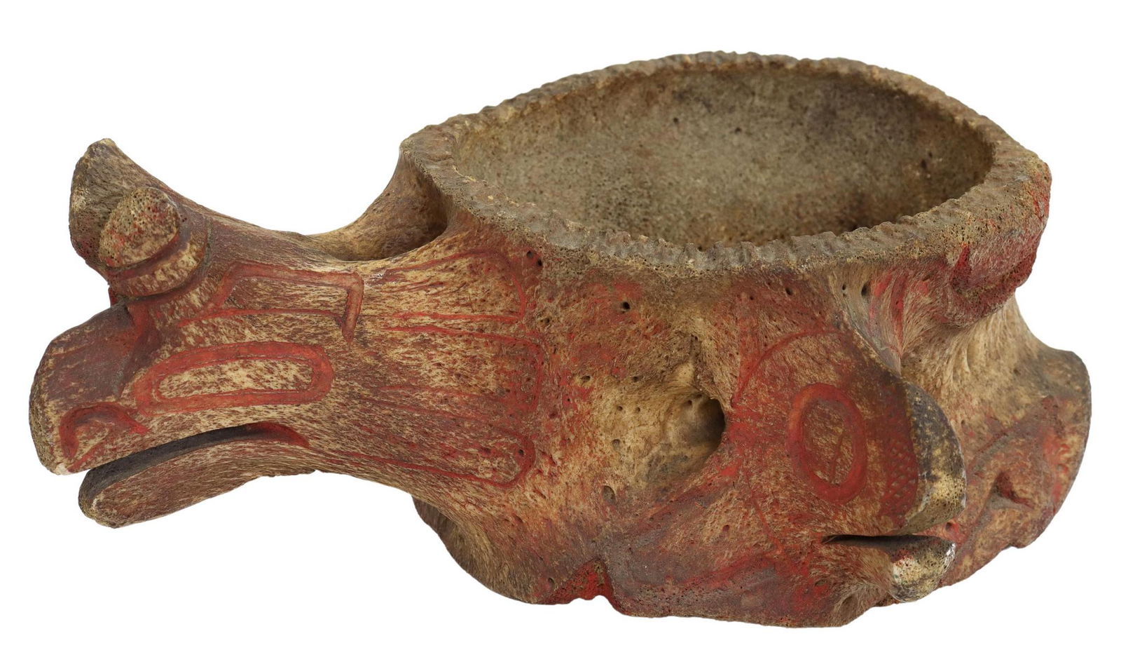 NORTHWEST COAST STYLE TOTEM WHALEBONE: Northwest Coast Native American style decorated whalebone vertebrae carved with totem figures and retaining faded red paint, late 20th c., approx 11.75"h, 10"w, 4.75"d, 2.25lbs *Provenance: Estate of