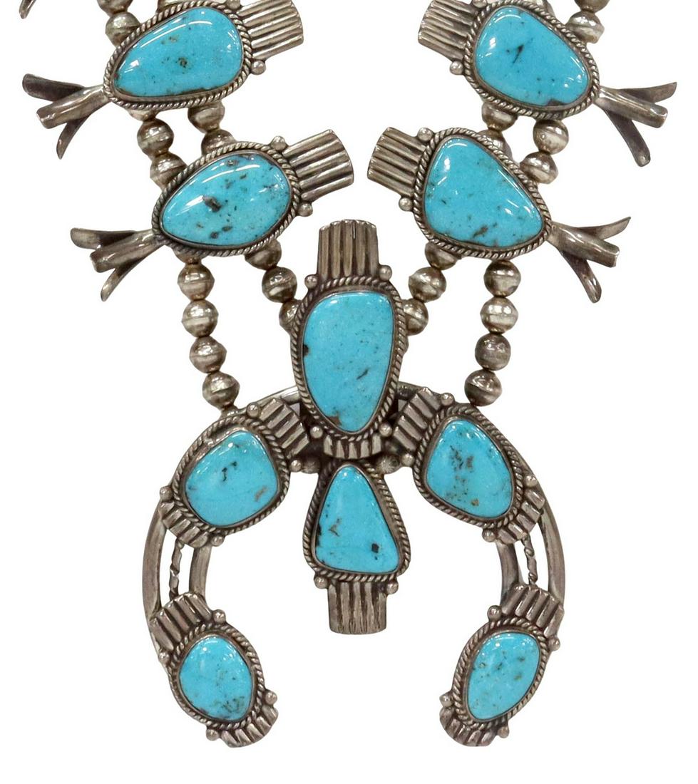 LARGE 3 HOGANS SHOP SQUASH BLOSSOM NECKLACE: Large Native American silver (content unknown) and turquoise squash blossom necklace, likely Navajo, bearing mark for 3 Hogans Shop, featuring ten turquoise-set blossoms, central naja pendant set with