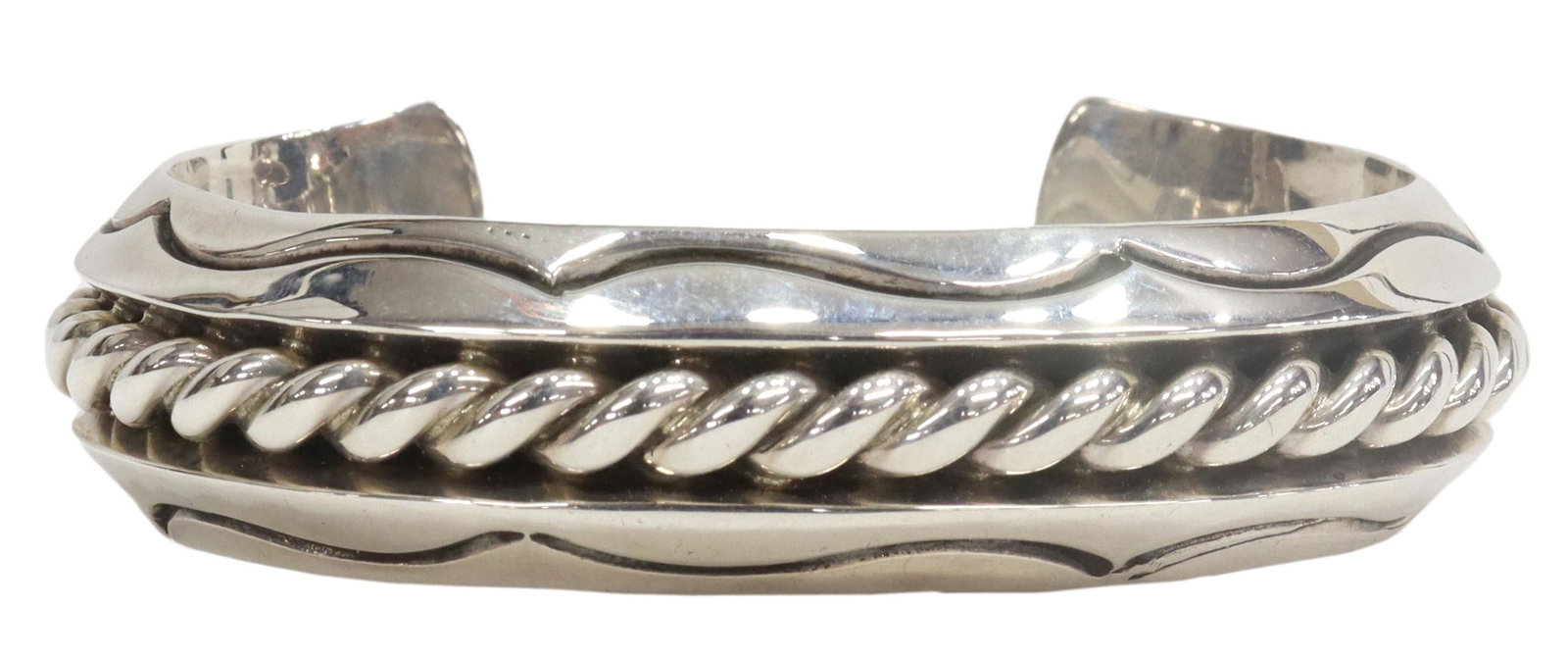 ALBERT LEE NAVAJO STERLING SILVER CUFF BRACELET: Native American sterling silver cuff bracelet, signed Albert Lee (Navajo, b. 1980), heavy 5/8"w cuff with central braided accent, interior: approx 5 3/8", gap: approx 1 1/8"w, 2.72ozt **Provenance: Li