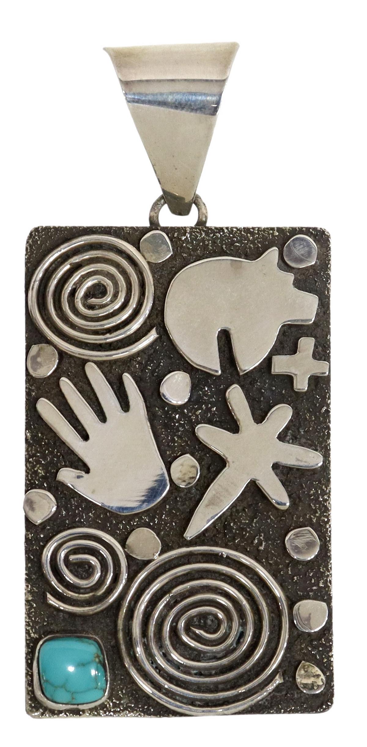 ALEX SANCHEZ NAVAJO STERLING PETROGLYPH PENDANT: Native American sterling silver petroglyph pendant, signed Alex Sanchez (Navajo, b. 1969), bear, dragonfly, hand of man and spiral design, small bezel set turquoise stone to the lower left, stampwork 