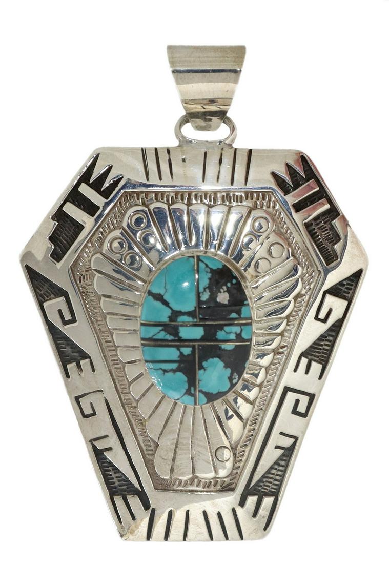 NATIVE AMERICAN SILVER OVERLAY & TURQUOISE PENDANT: Large Native American sterling silver overlay pendant, signed illegibly V '?', central channel inlaid turquoise oval, in an ornate surround, six-sided tapering pendant on wide bail, overall: approx 3.
