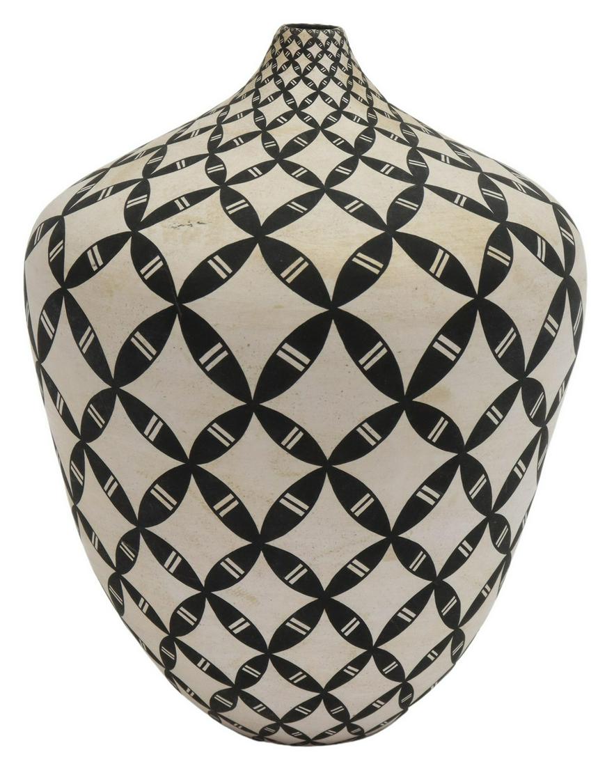 DOROTHY TORIVIO (D.2011) ACOMA BLACK-ON-WHITE JAR: Native American pottery seed jar, Dorothy Torivio (Acoma Pueblo, New Mexico, 1946-2011), decorated in black and white slips in an interlocking butterfly design, approx 7.5"h, 6.25"diam, 1.25lbs **Prov