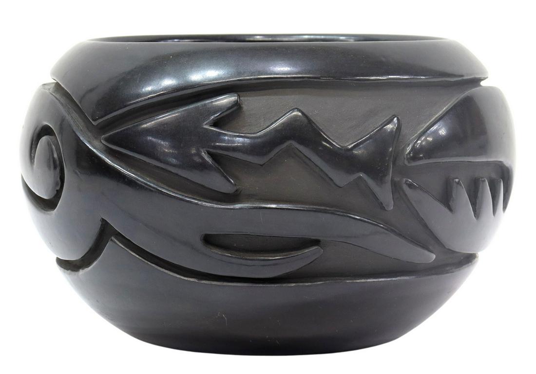 TERESITA NARANJO (D.1997) SANTA CLARA BLACKWARE: Native American blackware pottery jar, Teresita Naranjo (Santa Clara Pueblo, New Mexico, 1919-1997), deeply carved Avanyu water serpent design, signed underfoot, approx 5"h, 7.75"diam, 3.5lbs Start Pr