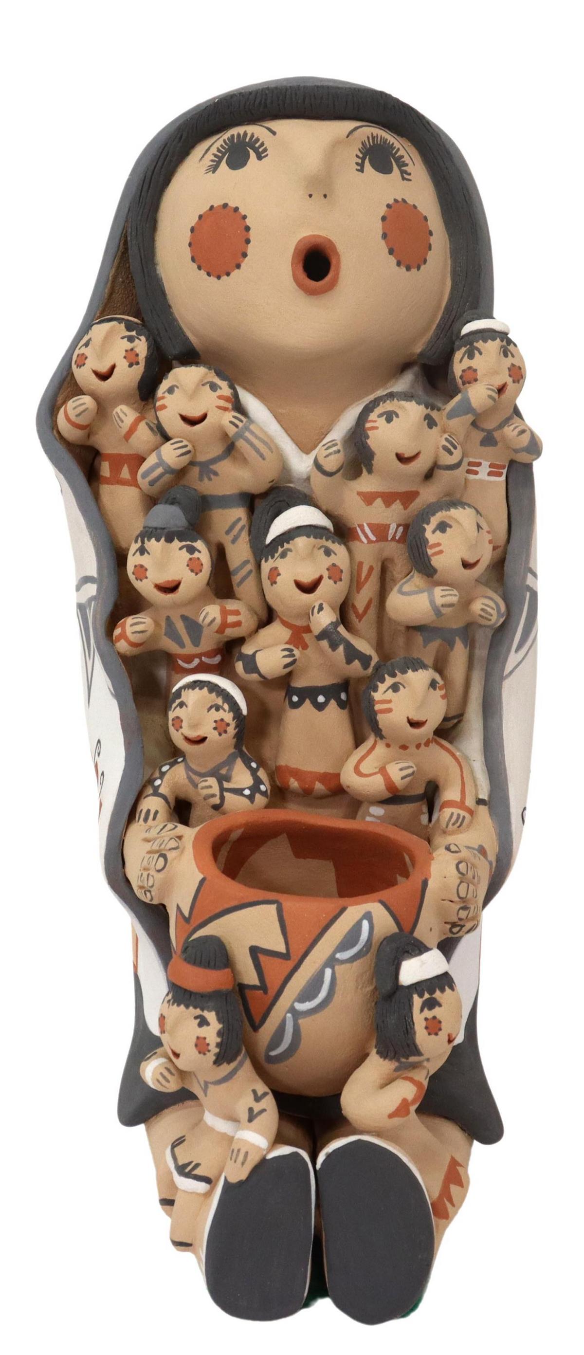EMILY FRAGUA TSOSIE (B.1951) JEMEZ STORYTELLER: Native American pottery storyteller figure, signed E. Fragua Tsosie (Emily Fragua Tsosie "Corn Pollen," Jemez Pueblo, New Mexico, b.1951), polychrome painted, depicting woman in patterned shawl with v