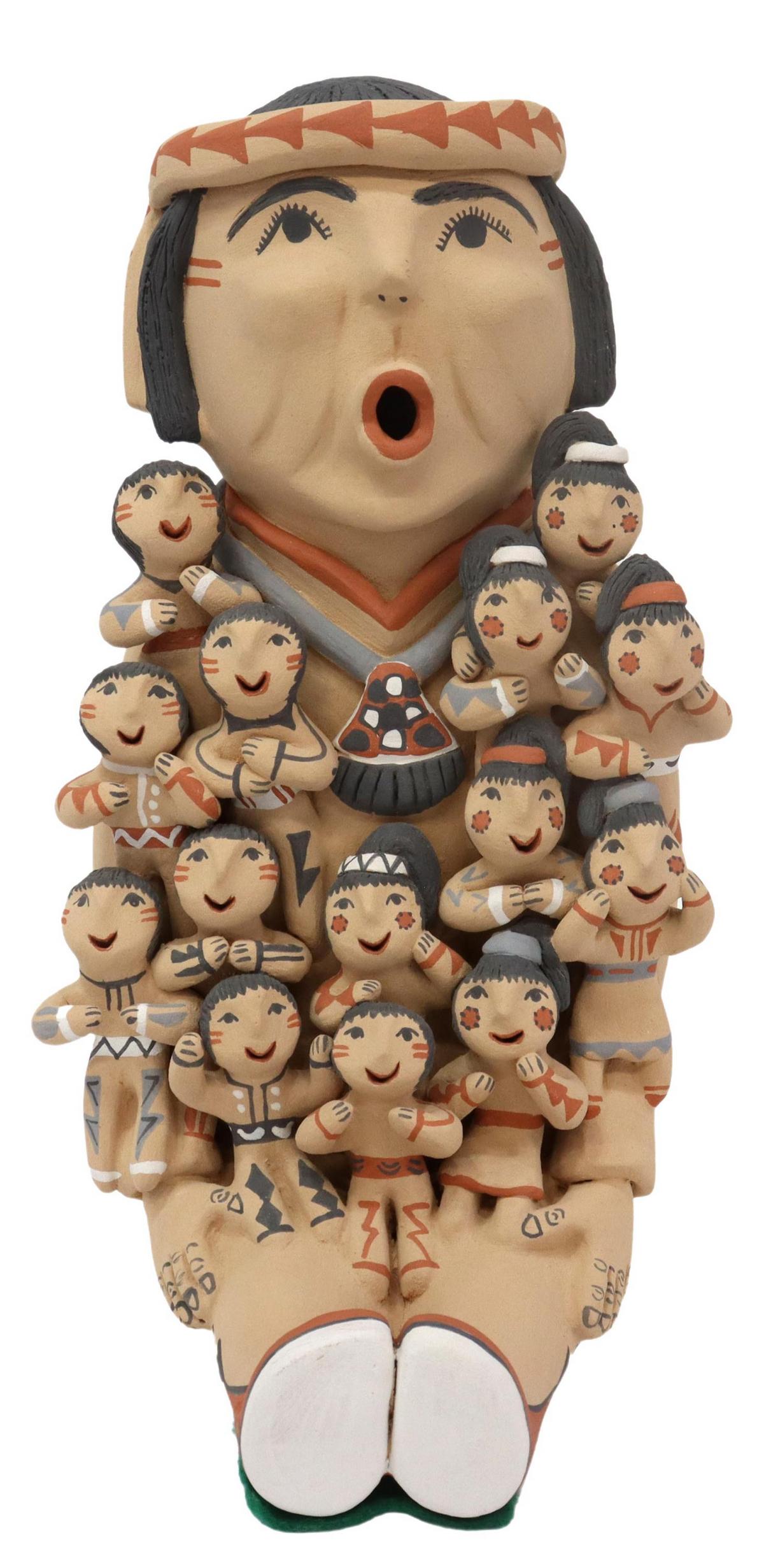 EMILY FRAGUA TSOSIE (B.1951) JEMEZ STORYTELLER: Native American pottery storyteller figure, signed E. Fragua Tsosie (Emily Fragua Tsosie "Corn Pollen," Jemez Pueblo, New Mexico, b.1951), polychrome painted, depicting man in patterned shirt and head