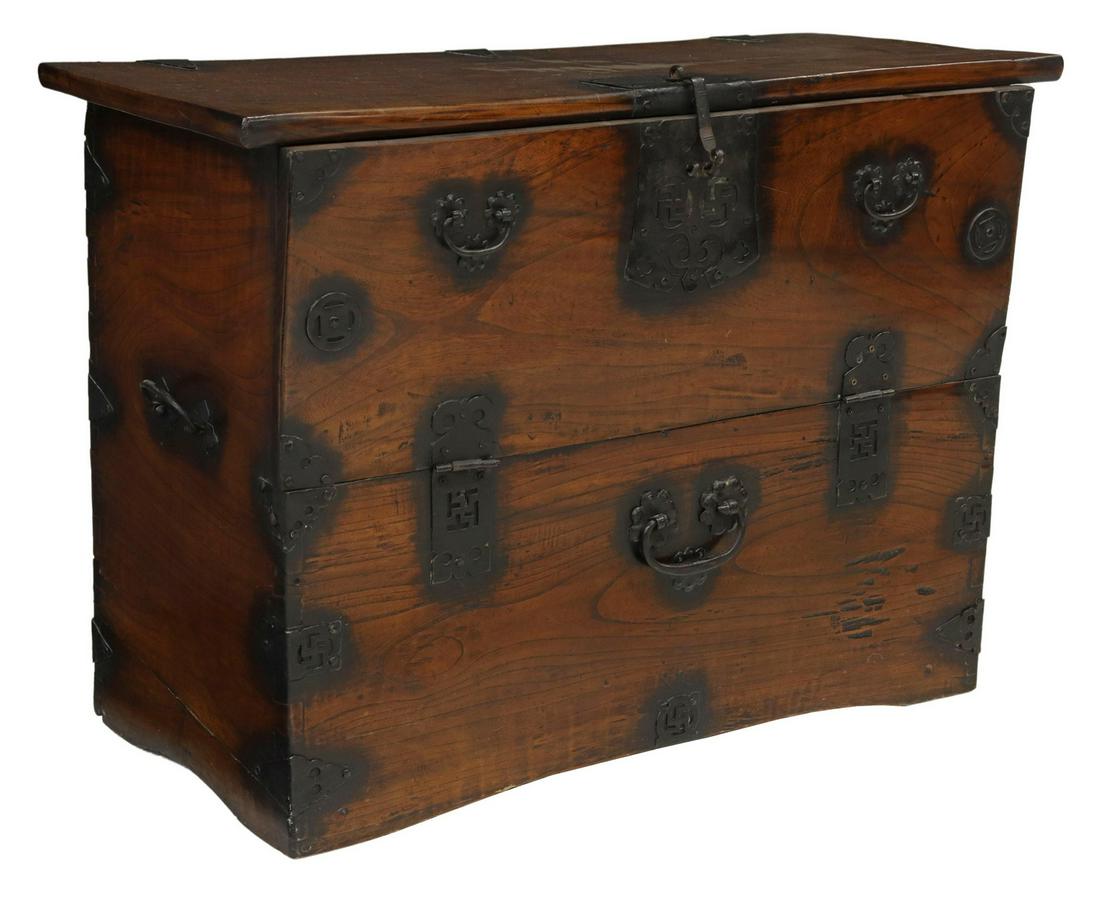 KOREAN IRON-MOUNTED ELM STORAGE CHEST: Korean iron-mounted elm (zelkova/ keyaki) storage chest (bandaji), single-board top, iron mounts with pierced Buddhist swastika symbol, drop-front panel, open interior, lacking lock pin, approx 23.5"h