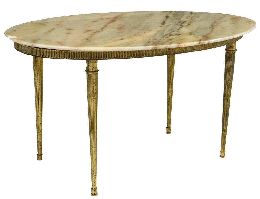 ITALIAN OVAL ONYX-TOP BRASS COFFEE TABLE: Italian onyx-top coffee table, 20th c., having oval stone top, over brass frame with ribbed apron, rising on tapered legs, ending in cap feet, chip to top, approx 16.5"h, 32"w, 19.5"d Start Price: $15