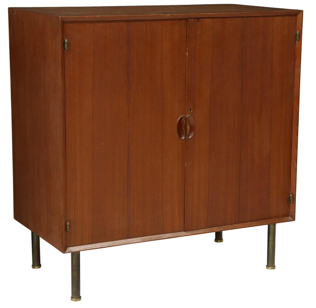 ITALIAN MID-CENTURY MODERN TEAK CABINET: Italian mid-century modern teak cabinet, c.1960s, two doors opening to three tray drawers, over adjustable-height shelf, rising on tubular brass legs, approx 37"h, 35.5"w, 19"d Start Price: $400.00