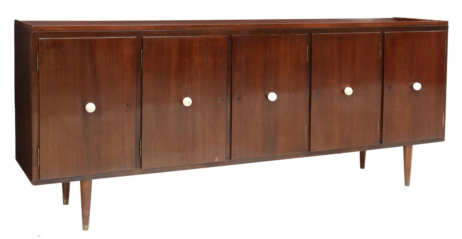 ITALIAN MID-CENTURY MODERN MAHOGANY SIDEBOARD: Italian mid-century modern mahogany sideboard, c.1950s, rectangular case, fitted with five cabinet doors, contrasting ball pulls, opening to shelving, seven drawers, rising on tapered legs, ending in