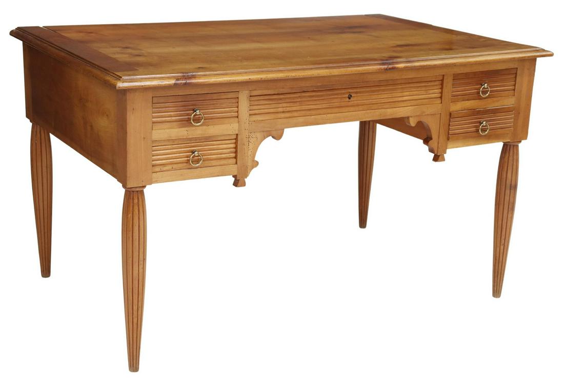 FRENCH ART DECO FRUITWOOD WRITING DESK: French Art Deco fruitwood writing desk, early 20th c., rectangular top, five drawers framing the center kneehole, rising on ribbed legs, finished on three sides, wood loss to top, approx 29.5"h, 50"w,
