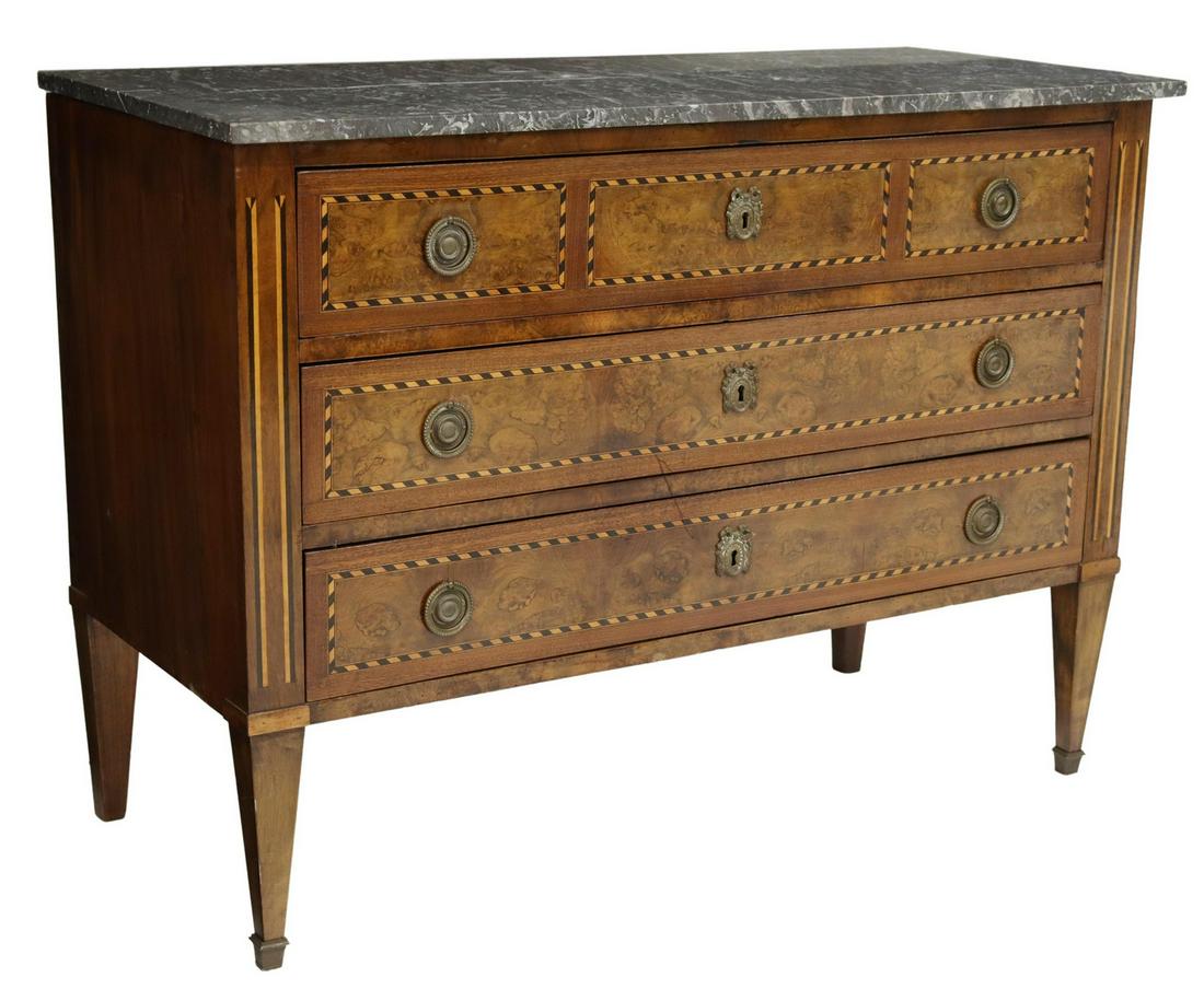 FRENCH LOUIS XVI STYLE MARBLE-TOP WALNUT COMMODE: French Louis XVI style marble-top walnut commode, late 19th c., having geometric inlay at the three drawers, rising on tapered squared legs, approx 32.25"h, 44.5"w, 19.25"d Start Price: $600.00