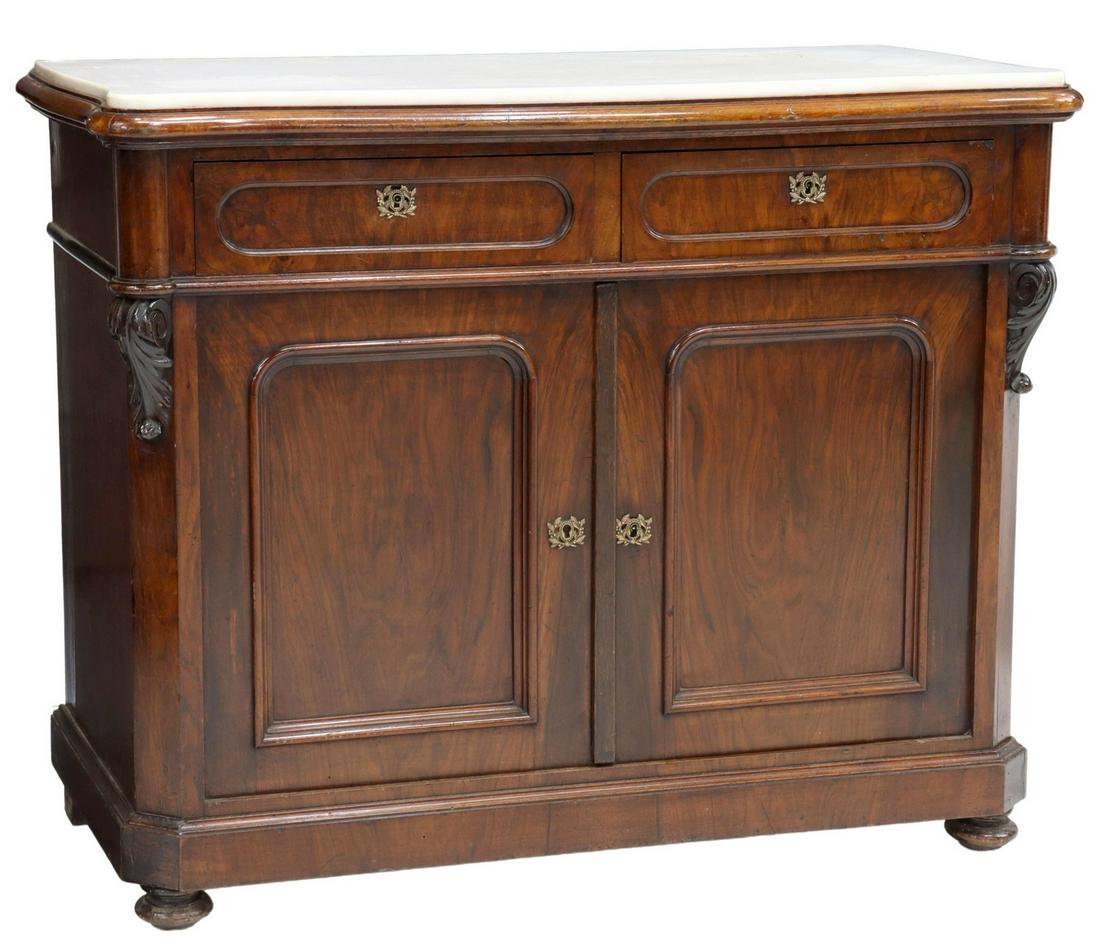FRENCH NAPOLEON III PERIOD MARBLE-TOP SIDEBOARD: French Napoleon III period mahogany sideboard, late 19th c., having inset marble top, over molded case, fitted with two drawers, two cabinet doors, opening to shelving, canted and carved foliate scrol