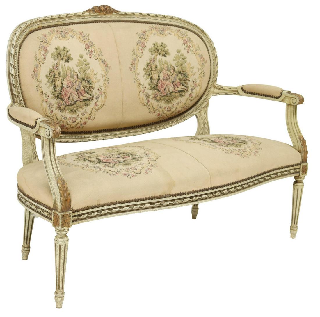 FRENCH LOUIS XVI STYLE PAINTED SALON SOFA: French Louis XVI style painted settee, early 20th c., having carved ribbon twist frame in an antiqued and parcel gilt finish, padded back, arms, and seat in figural garden landscape textile, fixed wit