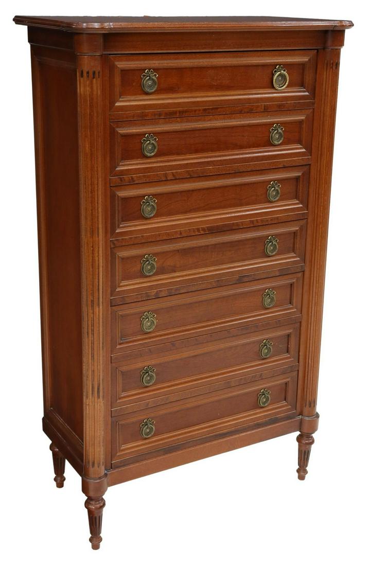 FRENCH LOUIS XVI STYLE MAHOGANY SEMAINIER: French Louis XVI style mahogany tall chest of drawers, late 20th c., projecting fluted corner posts, seven drawers, rising on tapered legs, (one) drawer pull with varied ring, approx 54.5"h, 32.5"w, 1