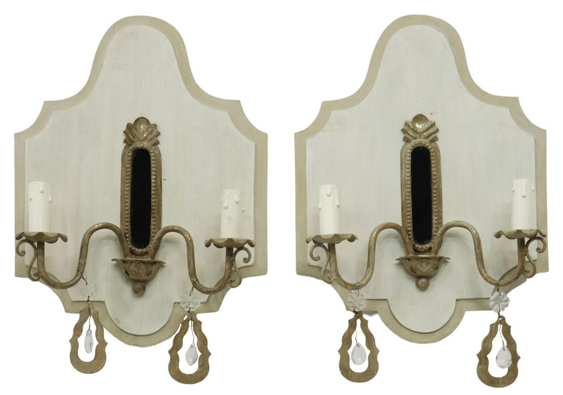 (2) CONTINENTAL WOOD & METAL 2-LIGHT WALL SCONCES: (pair) Continental painted wood two-light wall sconces, 20th c., shaped panel, with pressed metal frame and small mirror, issuing two curving arms, ending in floral bobeches and faux candles, accented