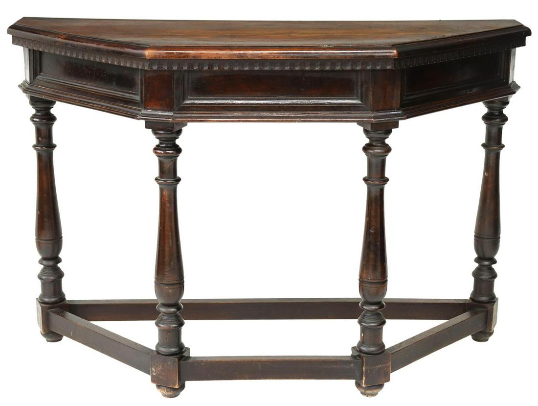 RUSTIC ITALIAN CANTED CONSOLE TABLE: Rustic Italian console table, 19th c., shaped top, over paneled apron, rising on turned legs, joined by box stretcher, approx 31"h, 47.25"w, 18"d Start Price: $200.00