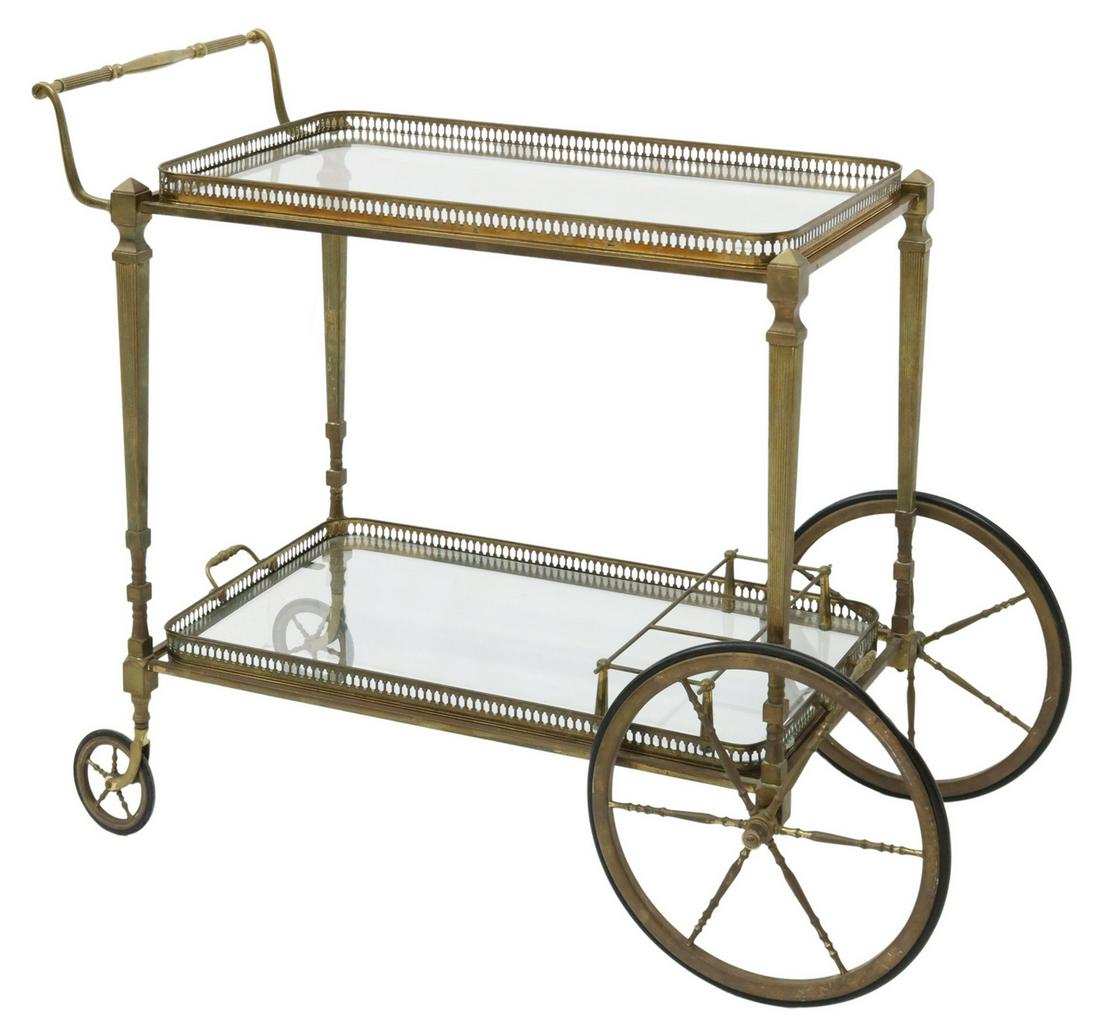 FRENCH BRASS TRAY-TOP SERVICE TROLLEY BAR CART: French brass service trolley/ bar cart, mid 20th c., glass top, lower tier with removable handled tray, tapered fluted legs, on spoked wheels, approx 29.25"h, 35.75"w, 19.5"d Start Price: $100.00