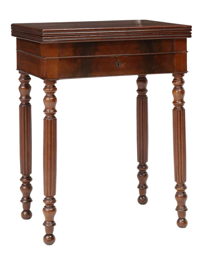 FRENCH LOUIS PHILIPPE PERIOD MAHOGANY GAMES TABLE: French Louis Philippe period mahogany games table, mid 19th c., hinged top, opening to inset felt playing surface, over a single drawer, rising on turned and reeded legs, closed: approx 28.75"h, 21.75