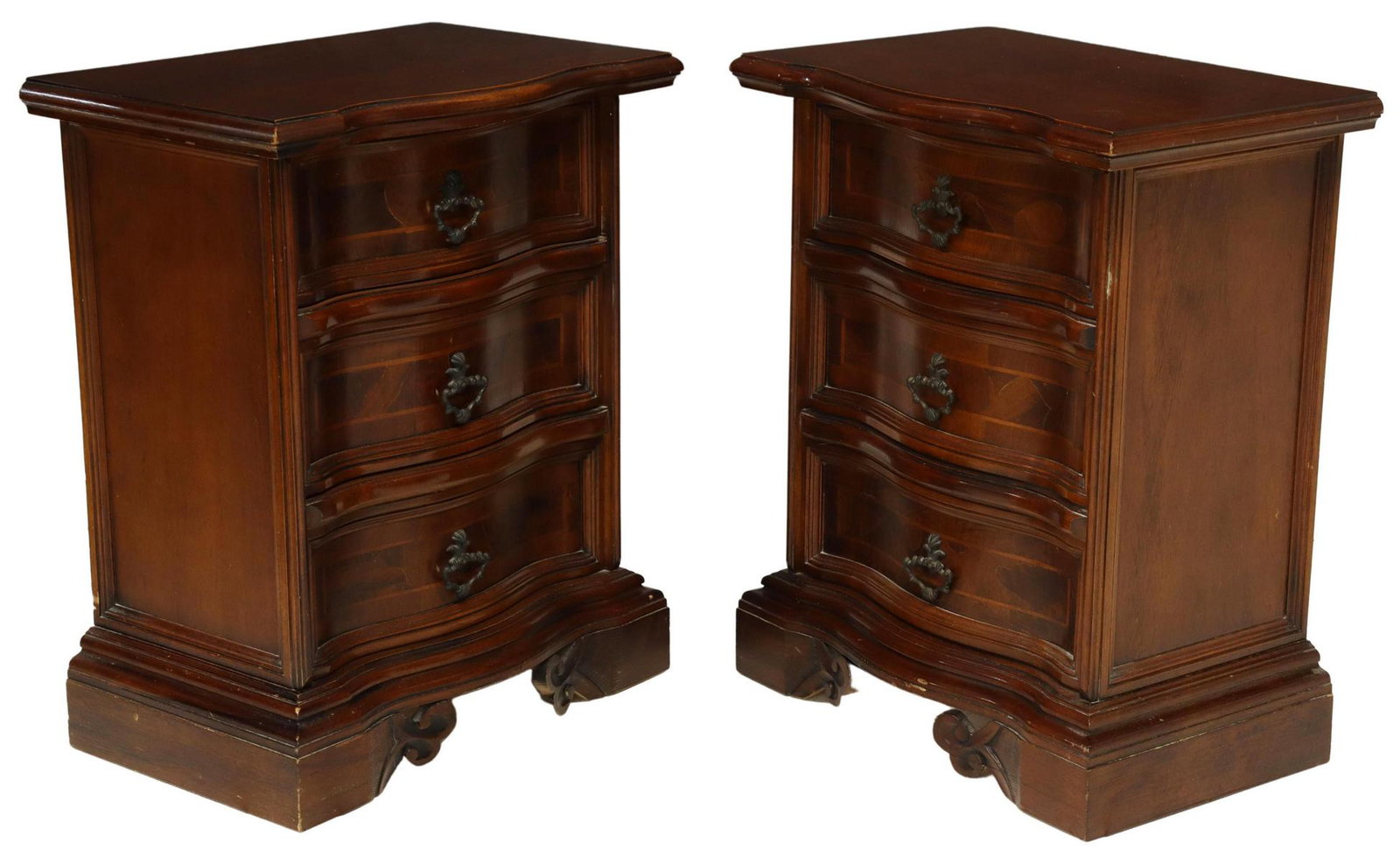 (2) ITALIAN PATCHWORK BEDSIDE TABLES NIGHTSTANDS: (pair) Italian bedside tables/ nightstands, 20th c., having shaped top, over conforming serpentine case, fitted with three drawers, decorated with patchwork veneers, contrasting string inlay, patinate
