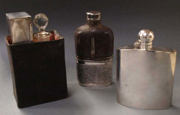 ANTIQUE RAILWAY COMPANION & ENGLISH PLATED FLASKS: (lot of 3) Two Birmingham flasks: (1) Mappin & Webb silver plate flask, 5.75"l, 4"w; (1) Henry Williamson Ltd. flask, the glass bottle having a leather clad upper section and fitted with a profusely e