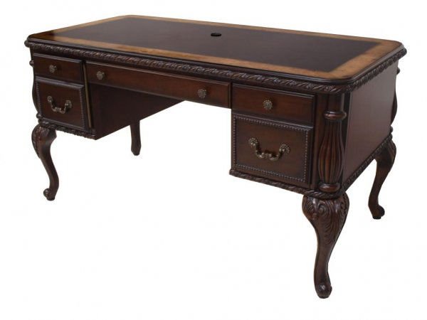 ANTIQUE STYLE EXECUTIVE DESK: Executive desk in the antique style, the rectangular top with contrasting burl finish border, above a central drawer flanked by two file drawers, supported on cabriole legs terminating in whorl feet,