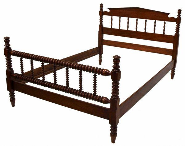 JENNY LIND SPOOL TURNED WALNUT BED: Jenny Lind spool turned walnut bed raised on elongated feet, 46"h, 54.25"w, 76"l