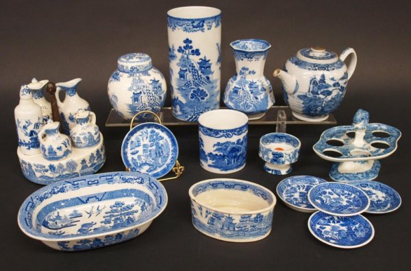 GROUP OF ASSORTED BLUE WILLOW, CASTOR SET, VASES: (lot of 15) Antique and later blue willow tableware, condiment holder on a pedestal foot with lions head handle, lacking bottles, a Japan condiment holder with cruets for oil, vinegar, salt and pepper
