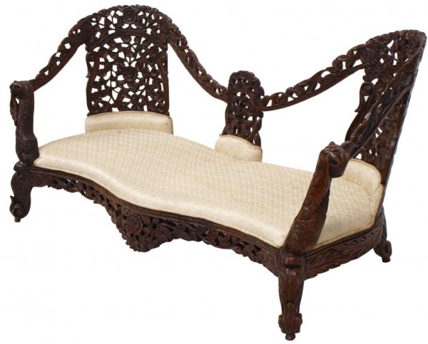 19TH C PORTUGUESE COLONIAL CARVED ROSEWOOD SETTEE: Portuguese Colonial carved rosewood sofa, 19th c, vining grape and foliate motif throughout the detailed frame, arm rests faced with lion masks, curving padded seat raised on scrolled acanthus legs, 3