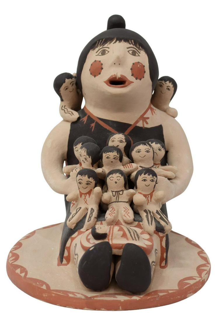 EMILY FRAGUA-TSOSIE (B.1951) JEMEZ STORYTELLER: Native American pottery storyteller, Jemez Pueblo, signed underfoot E. Tsosie (Emily Fragua-Tsosie, New Mexico, b.1951), polychrome painted, depicting a woman with several small children and a baby, a