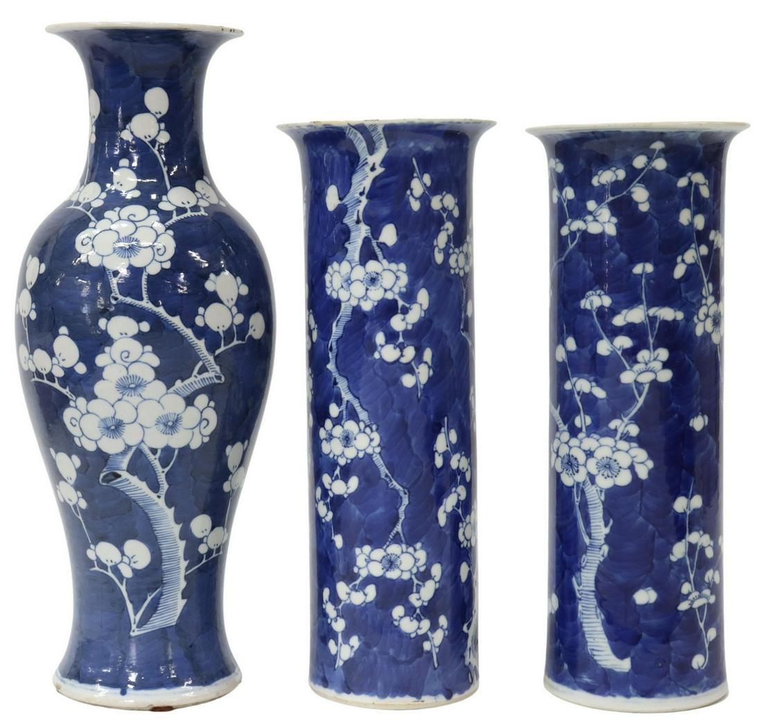 (3) CHINESE BLUE & WHITE PRUNUS PORCELAIN VASES: (lot of 3) Chinese blue and white enameled porcelain vases, similarly styled, decorated in cherry blossom motif, comprising: (pair) having cylindrical form with flared rim, each bearing apocryphal Kan