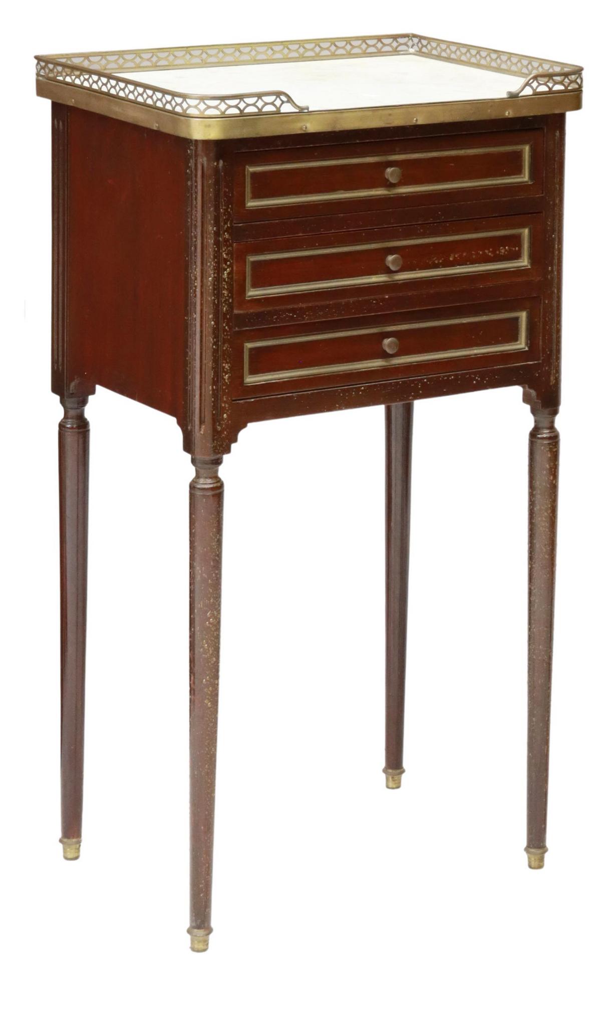 FRENCH LOUIS XVI STYLE MARBLE-TOP NIGHTSTAND: French Louis XVI style mahogany nightstand, 20th c., pierced brass three-quarter gallery, enclosing the marble top, over three drawers, rising on tapered legs, bubbling to finish, approx 29"h, 15.75"w