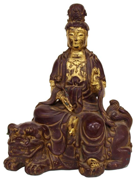 ANTIQUE BRONZE PARCEL GILT GUANYIN STATUE: Parcel gilt bronze Guanyin (Quan Am) figure, seated on a foo dog with a scepter ball, characters at base, 11.25"h, 8.25"w, 5.25"d, 8lbs total