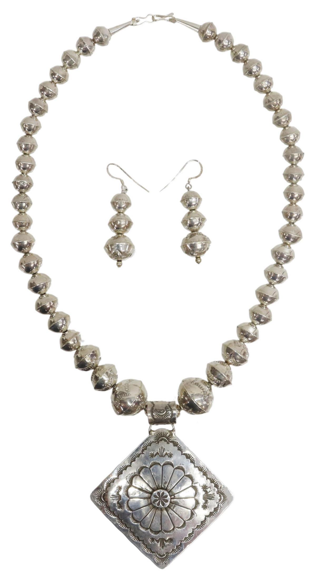 (2) RICK ENRIQUE NAVAJO STERLING PENDANT & JEWELRY: (lot of 2) Native American jewelry, including: (1) pendant necklace, sterling silver pendant with stylized stampwork, signed RE (Rick Enrique, Navajo, 20thc), on an assembled, bench bead strand with s