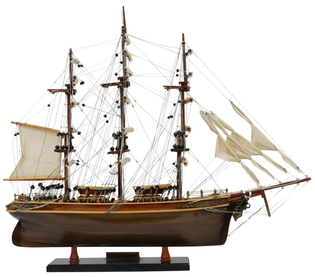 BRITISH CLIPPER 'CUTTY SARK' SHIP MODEL: British clipper ship model, 20th c., based on the Cutty Sark, in use between 1869-1895, with three masts, open fore topsail, sixteen furled sails, four furled mizzen sails, extensive rigging including