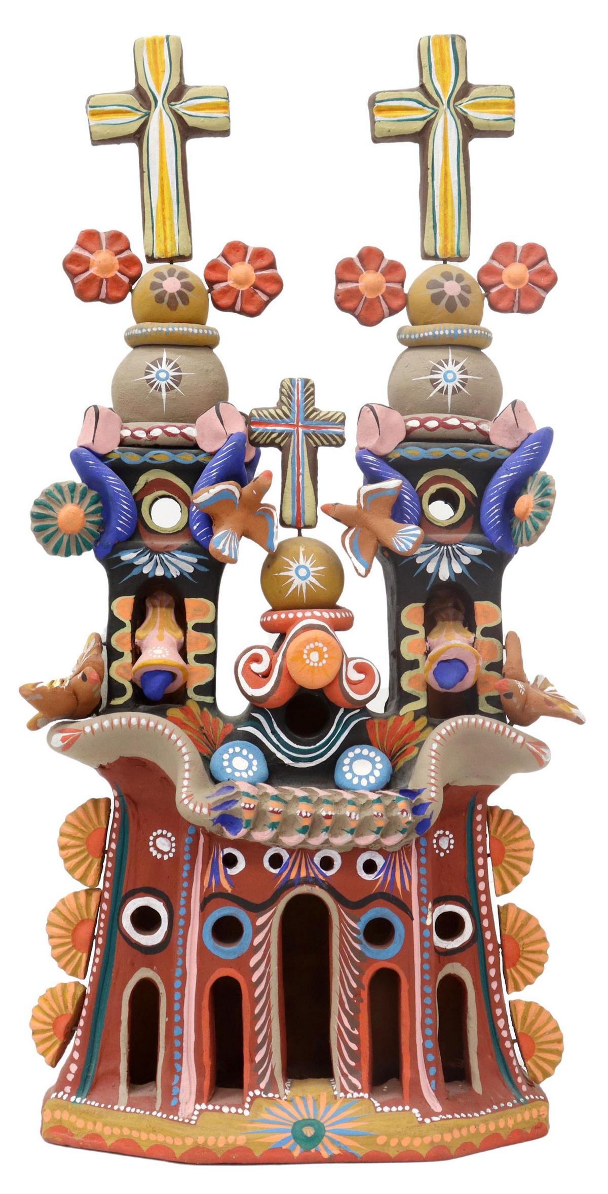 MEXICAN FOLK ART HAND-PAINTED CHURCH LUMINARIA: Folk Art pottery luminaria/ candle lantern, Mexico, slab built and hand painted pueblo church with two bell towers surmounted by crosses, applied flowers and birds, arcade windows, approx 21"h, 8.25"w