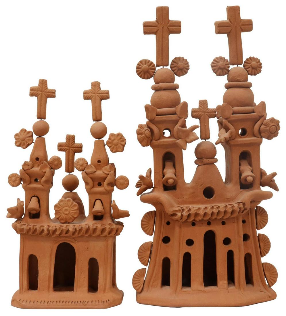 (2) MEXICAN FOLK ART TERRACOTTA CHURCH LUMINARIA: (lot of 2) Folk Art unglazed terracotta luminaria/ candle lanterns, Mexico, slab built pueblo church with two bell towers surmounted by crosses, applied flowers and birds, arcade windows, larger examp