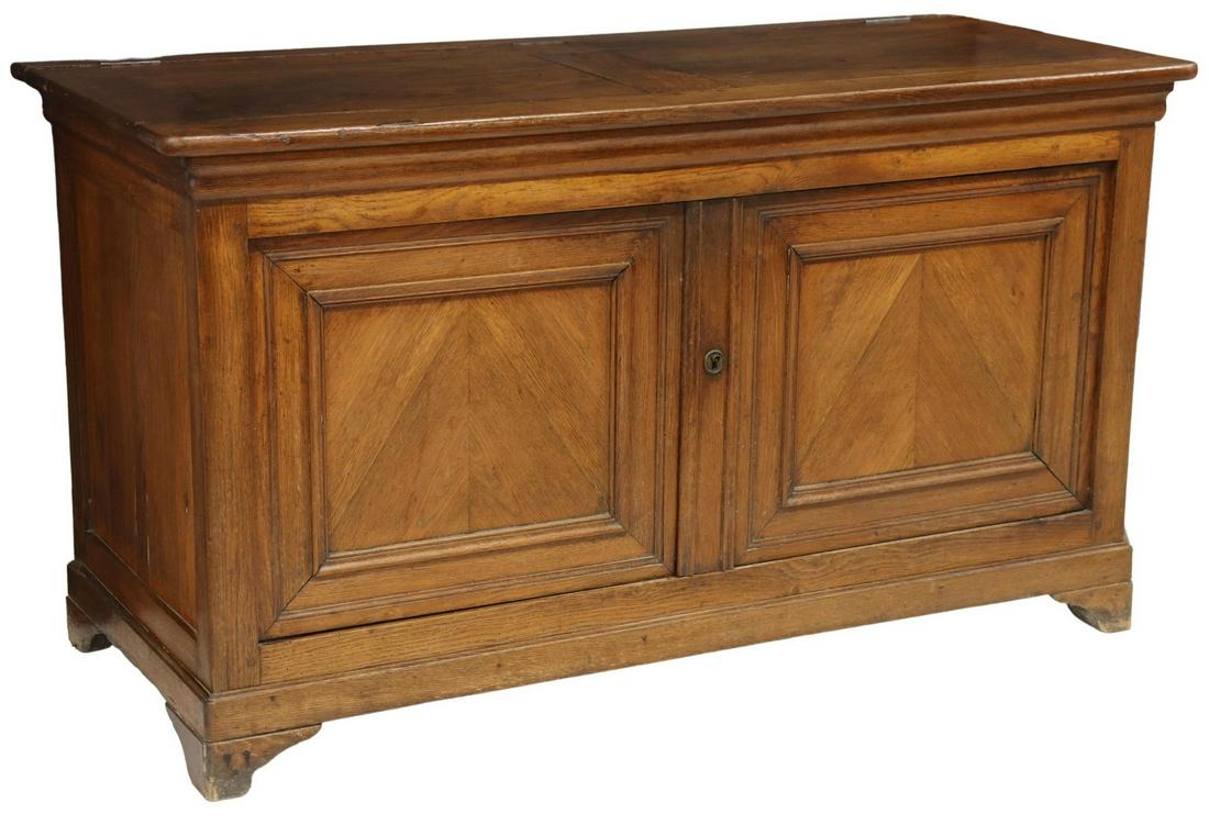 FRENCH PROVINCIAL OAK DOUGH BIN ON CABINET BASE: French Provincial oak dough bin on cabinet base, early 20thc, hinged top, opening to trough interior, over double-door cabinet, containing two shelves, rising on bracket feet, approx 32.5"h, 58.25"w, 