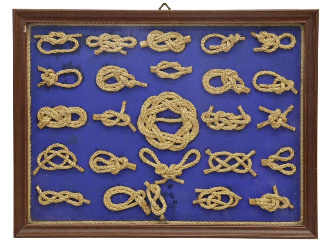 TWENTY-FIVE FRAMED NAUTICAL KNOTS: Framed nautical knots, twenty-five knots on blue ground, knots including: double figure eight, double carrick bend, sheet bend, one knot unglued from ground, overall: approx 19"h, 14.5"w, 1.75"d, 5.75