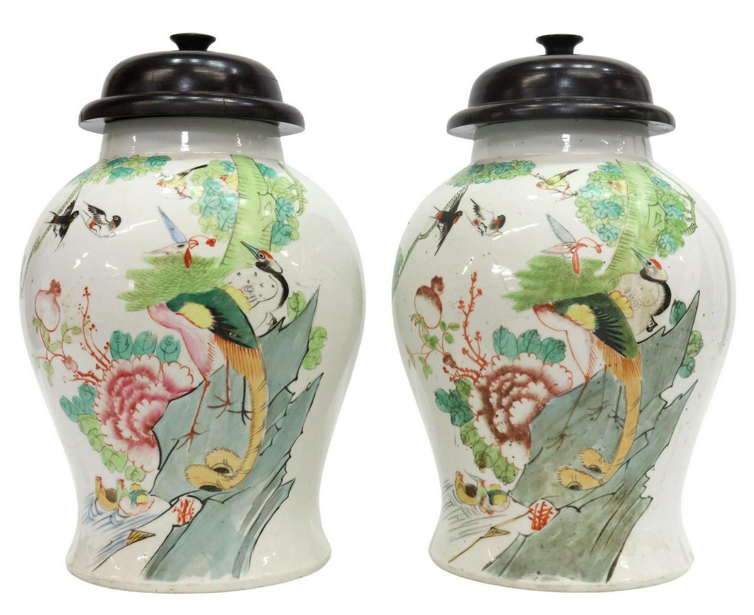 (2) CHINESE PORCELAIN LIDDED TEMPLE JARS: (pair) Chinese porcelain temple jars, domed wood lid with knop finial, body decorated with birds perched on floral branches, reverse with calligraphy, retaining wax seals, (one) with hairline at foot,