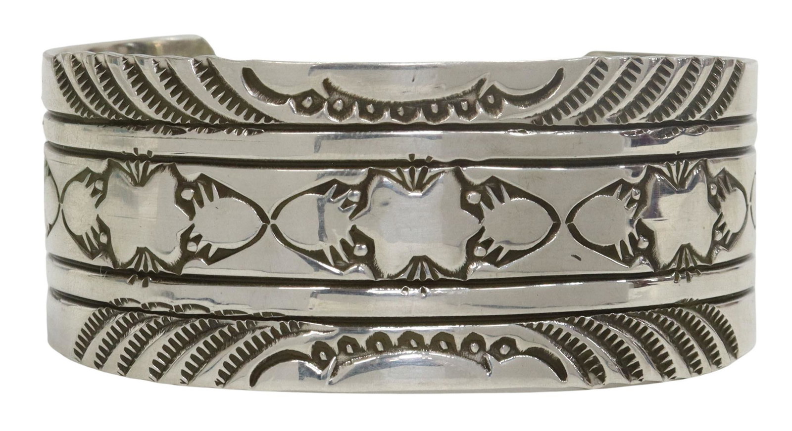 RICK ENRIQUEZ NAVAJO STAMPED STERLING SILVER CUFF: Native American sterling silver cuff bracelet, signed RE (Rick Enriquez, Navajo, 20th c.), with stamped designs, approx 1 1/8"w, interior: approx 5 5/8"l, gap: approx 1.5"w, 1.89ozt **Provenance: Eigh