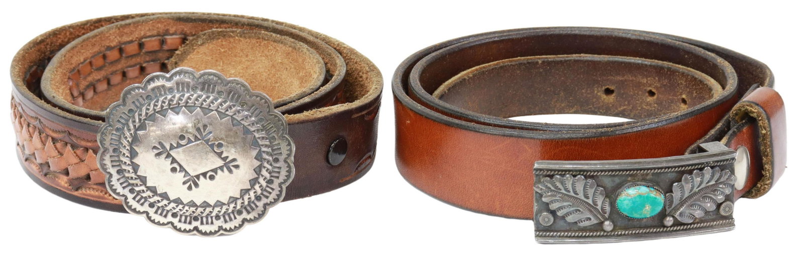 (2) SOUTHWEST SILVER BUCKLES ON LEATHER BELTS: (lot of 2) Southwest style belt buckles, each on leather belt, including: (1) silver (content unknown) concho buckle with stampwork, on mellowed, woven and embossed leather belt, 32, buckle: approx 2 