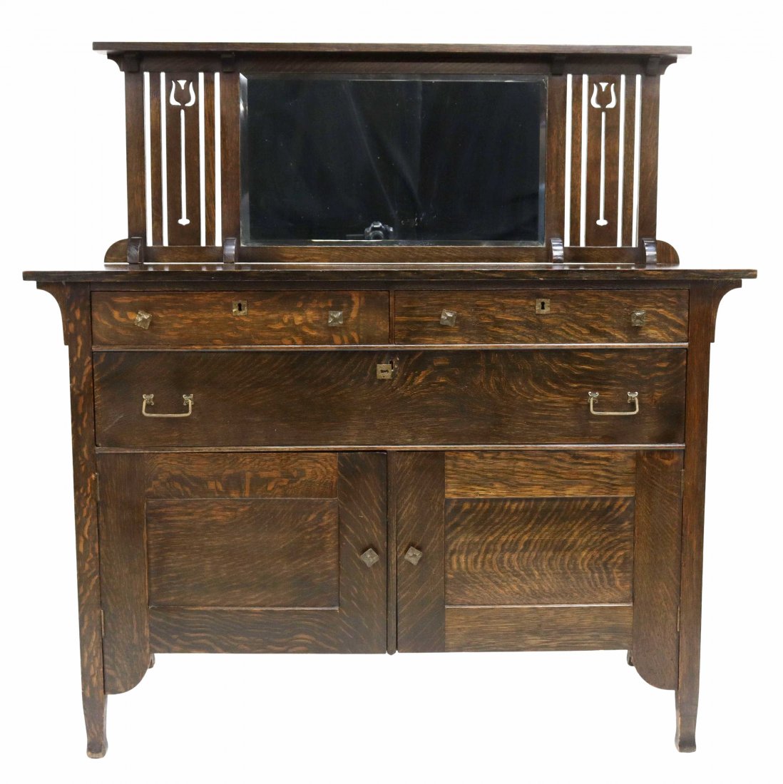 AMERICAN LUCE CRAFTSMAN OAK MIRRORED SIDEBOARD: American Arts and Crafts oak sideboard, The Luce Furniture Company, early 20th c., raised backsplash, shelf with plate groove, slats with pierced tulip design, centering a beveled mirror plate, over t