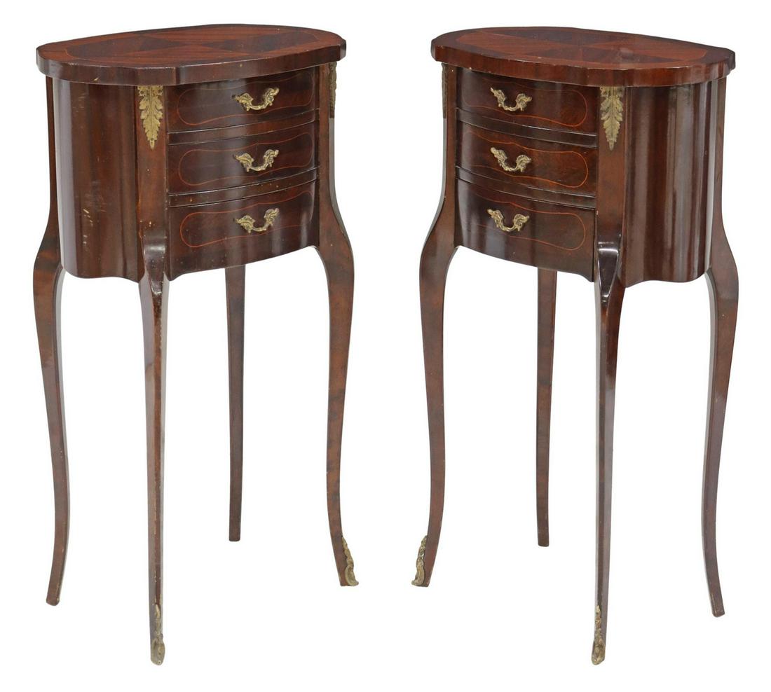 (2) FRENCH LOUIS XV STYLE MAHOGANY NIGHTSTANDS: (pair) French Louis XV style mahogany nightstands, 20th c., cartouche-shaped top with string inlay, over three drawers, rising on cabriole legs, ending in front sabots, (one) with abrasion to top and 