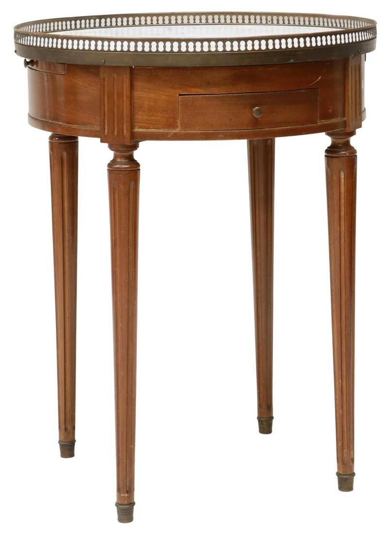 FRENCH LOUIS XVI STYLE MARBLE-TOP BOUILLOTTE TABLE: French Louis XVI style mahogany bouillotte table, 20th c., pierced brass gallery enclosing the marble top, apron fitted with two drawers, two pull-out slides, rising on tapered fluted legs, ending in 